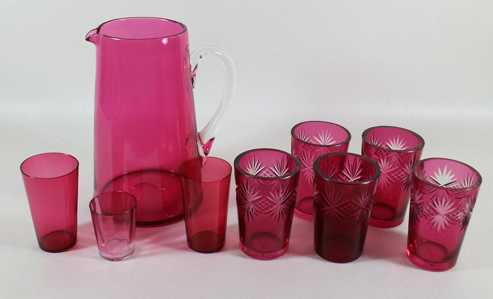 19th CENTURY CRANBERRY GLASS PITCHER & GLASSES: Includes a cranberry glass pitcher, shot glass, juice glasses and 5 cut to clear glasses.
