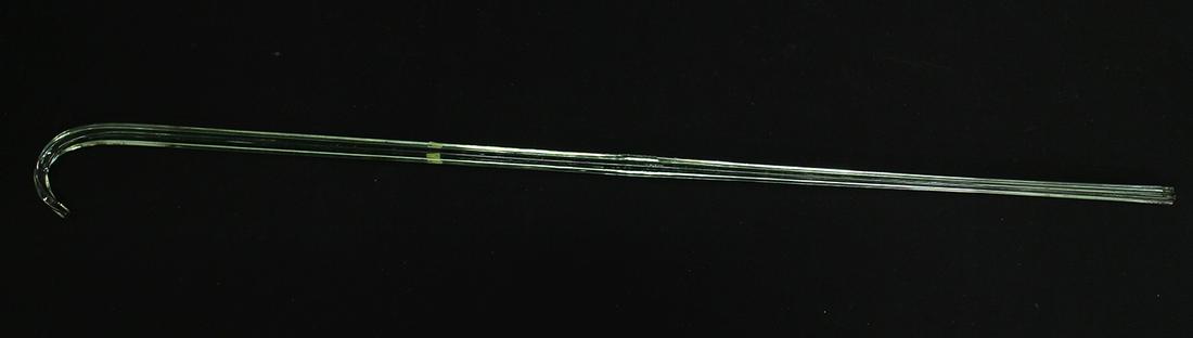GREEN GLASS CANE: Green glass cane walking stick. Measures 39.5" long.