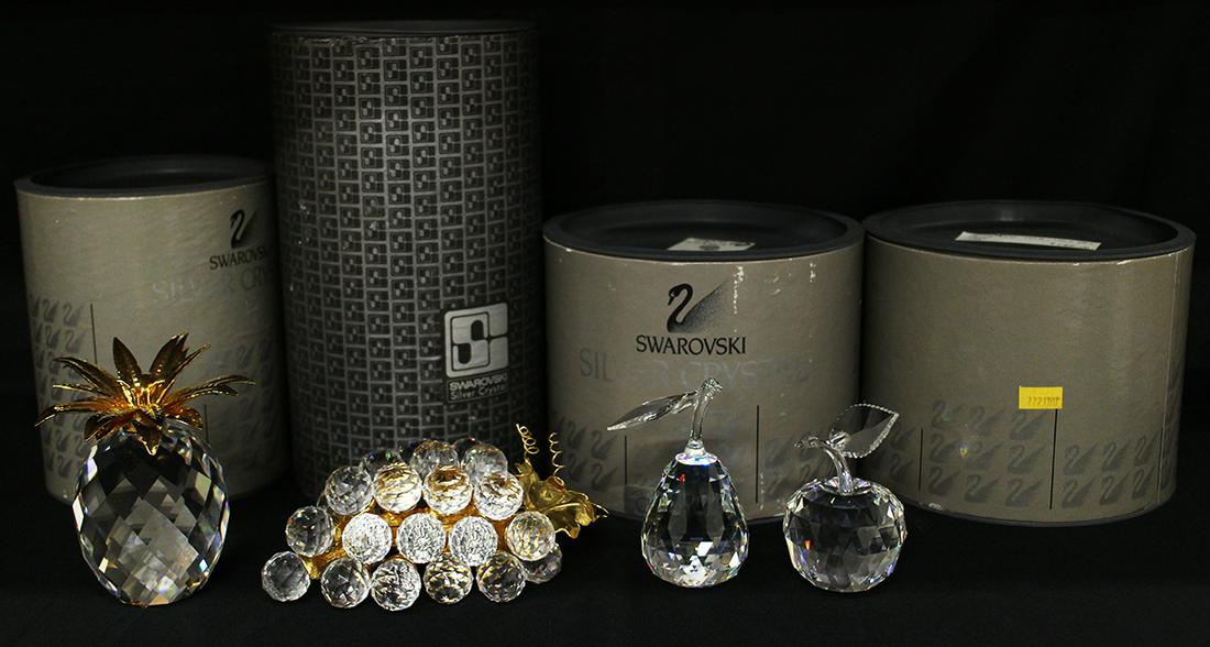 (4) SWAROVSKI CRYSTAL FRUIT W/ BOXES: Swarovski Crystal fruit collection including pear, apple, pineapple, and grapes with original boxes.