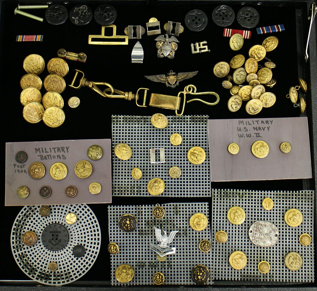 WWI / WWII US MILITARY BUTTONS & MEDALS: A large collection of United States Military items to include an Amico Gold filled sterling Navy Airforce Pilot Wings, a Hilborn Hamburger Cap Insignia, Uniform Bars, Uniform Buttons and more.