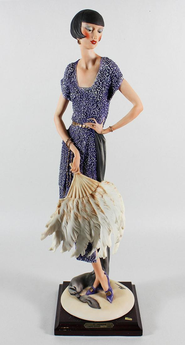 GIUSEPPE ARMANI #387C "LADY WITH FAN" LIMITED ED: Giuseppe Armani Lady holding a feather fan. It is a limited edition numbered 72 / 5000. It measures 19" tall. Includes box.