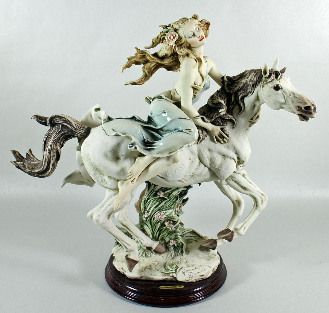 GIUSEPPI ARMANI LIBERTY FIGURINE: Giuseppe Armani girl riding horse "Liberty" figurine # 903. Measures 15" tall 16" wide. Numbered 344/5000. Includes original box.