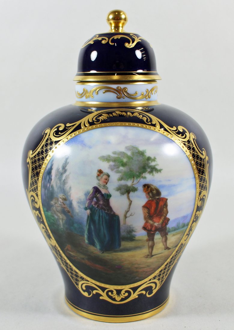 AUGARTEN WIEN PORCELAIN URN: Blue and gold urn with hand painted oval scene. Signed AB lower right. Measures 8.75" tall.