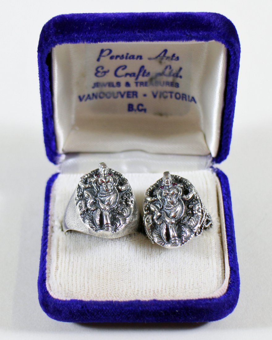 (2) PERSIAN ARTS STERLING RINGS: Pair of Persian Arts sterling silver rings with original box from Persian Arts & Crafts LTD Jewelers in Vancouver Canada. The rings depict a Persian Goddess accented with ruby, diamond, and emerald st