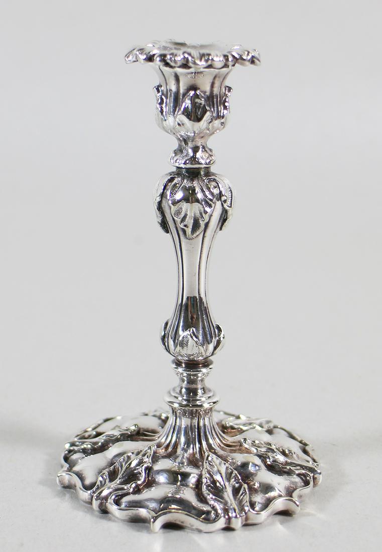 ENGLISH SILVER TAPERSTICK: English silver hallmarked taperstick. Three hallmarks on base. Measures 4.25" tall, 4.9 OZT.