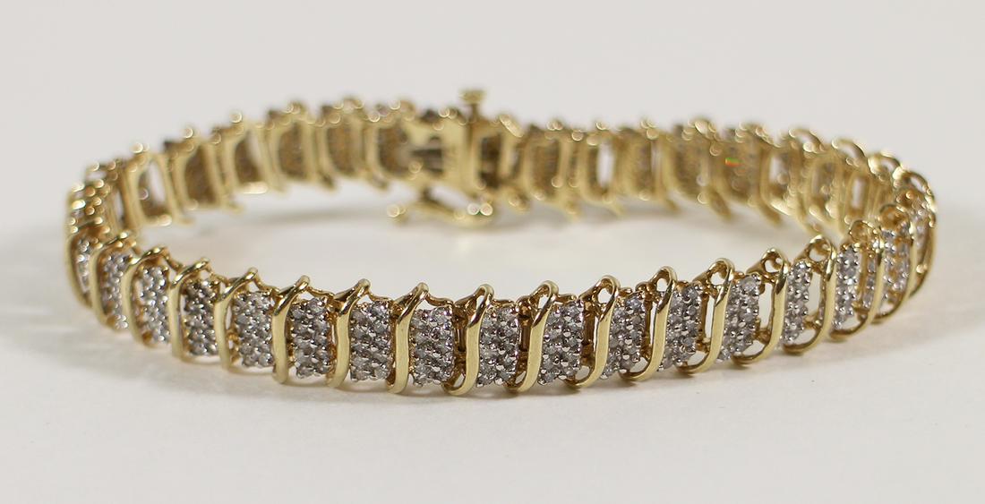 10K 3.00 CARAT DIAMOND TENNIS BRACELET: 10KT Yellow gold tennis bracelet with 380 diamonds (3.00 TCW H-I color I clarity). 14.4 grams, 7" long.