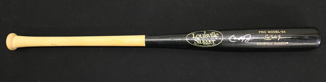 CAL RIPKIN JR. AUTOGRAPHED BASEBALL BAT (1 of 2)