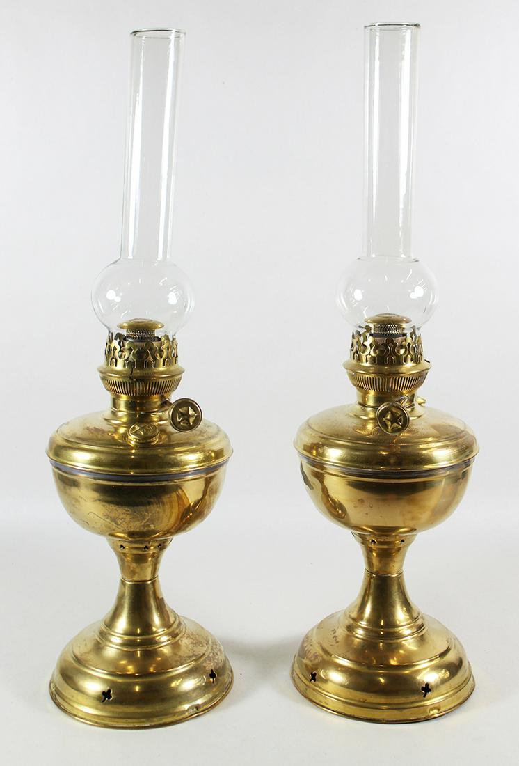 (2) BRASS OIL LAMPS: TCHCO Lovell & Company brass oil lamps. 11" tall without chimney.