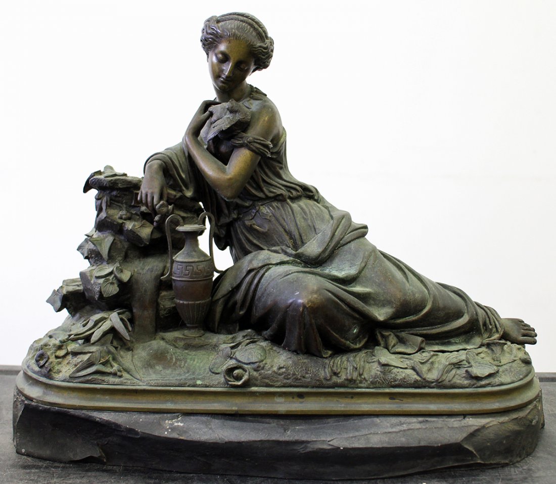 BRONZE RECLINING FEMALE SCULPTURE: French bronze sculpture of a reclining woman with bird & urn. Bronze not attached to base. 16" wide.