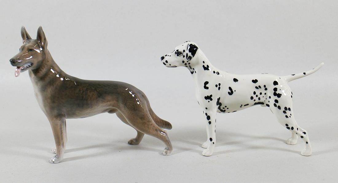 (2) PORCELAIN DOG FIGURINES: Beswick dalmation and Royal Copenhagen German Shepherd. 8" long.