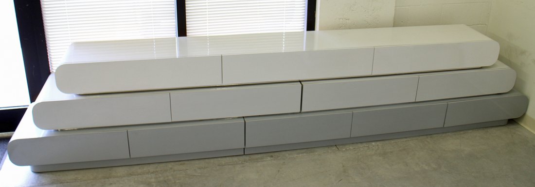 RETRO 80'S DECO STACKED CONSOLE UNIT: Vintage 1980's laminate stacked console in a light to dark grey color scheme. Custom made in Miami. When the unit is separated there is some damage to middle and nail holes to the top area of bottom p