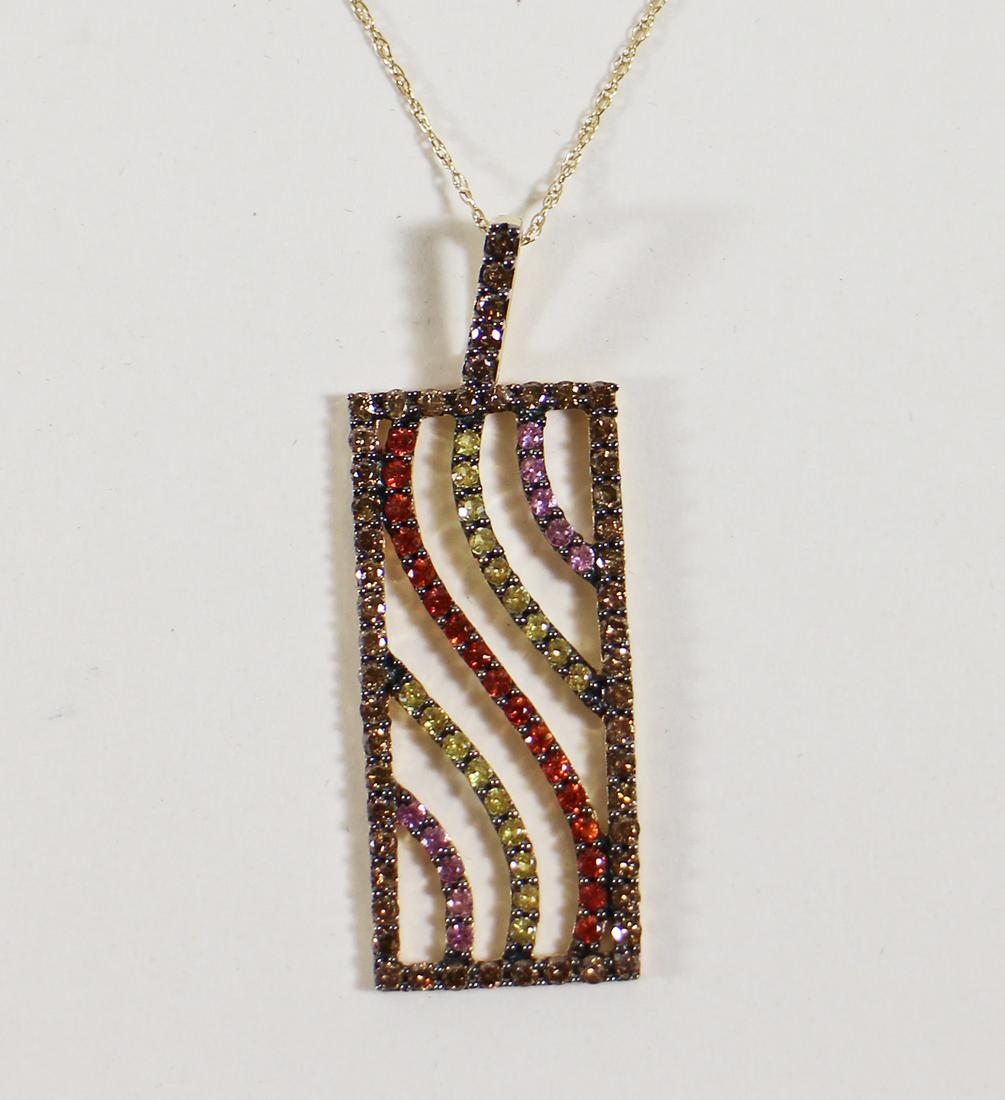 14KT GOLD MUTLI COLORED SAPPHIRE NECKLACE: Modernistic pendant set in 14K yellow gold with rows of colored sapphires in yellow, pink, orange and champagne hues. The pendant measures 2" x 3/4" and is on a 14K 18" chain. It weighs 5.4 grams.