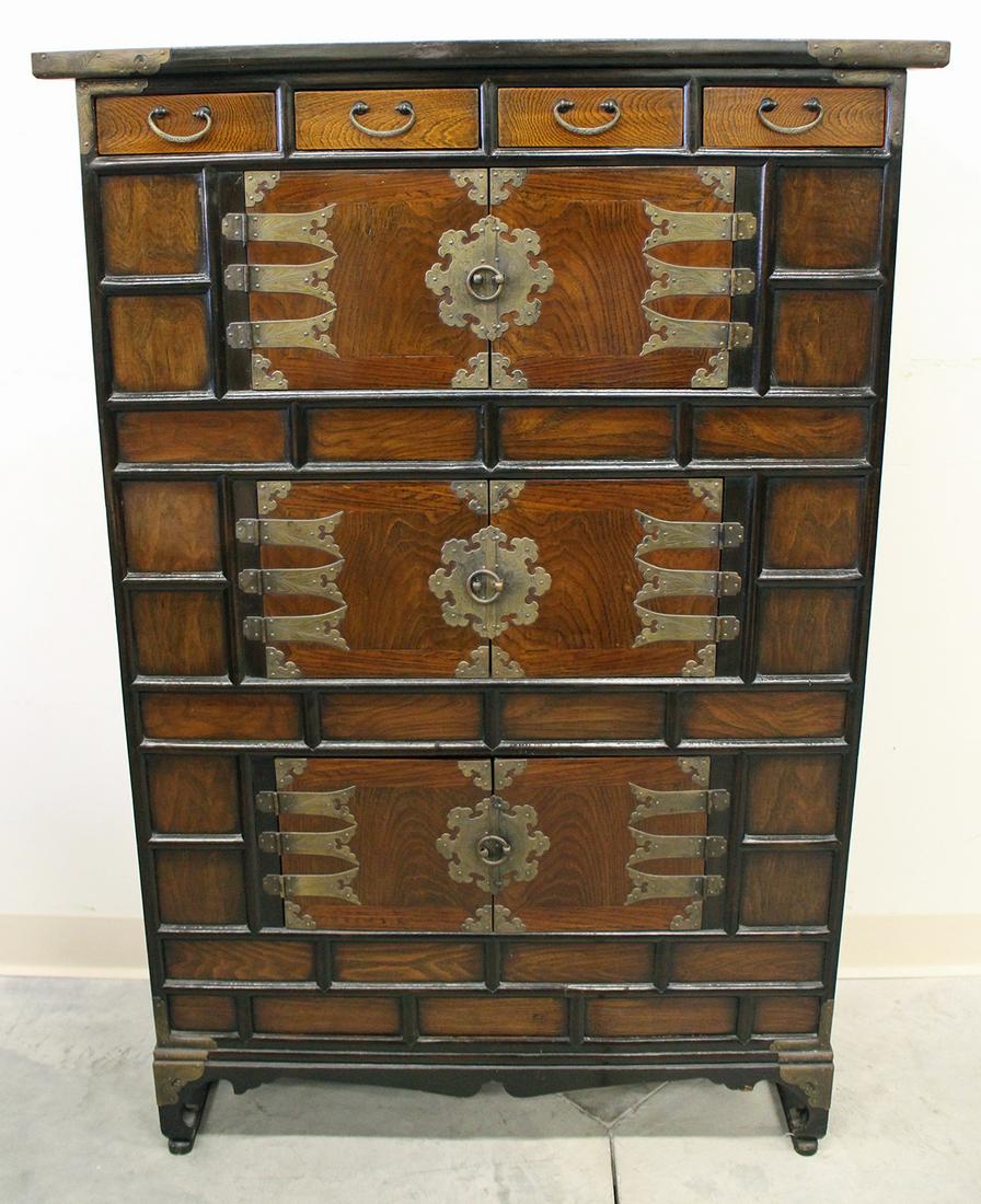 KOREAN TALL DRESSER: Korean tall wood dresser chest with four drawers at top and three sets of double doors. Measures 51.25" tall 35" x 15" wide.