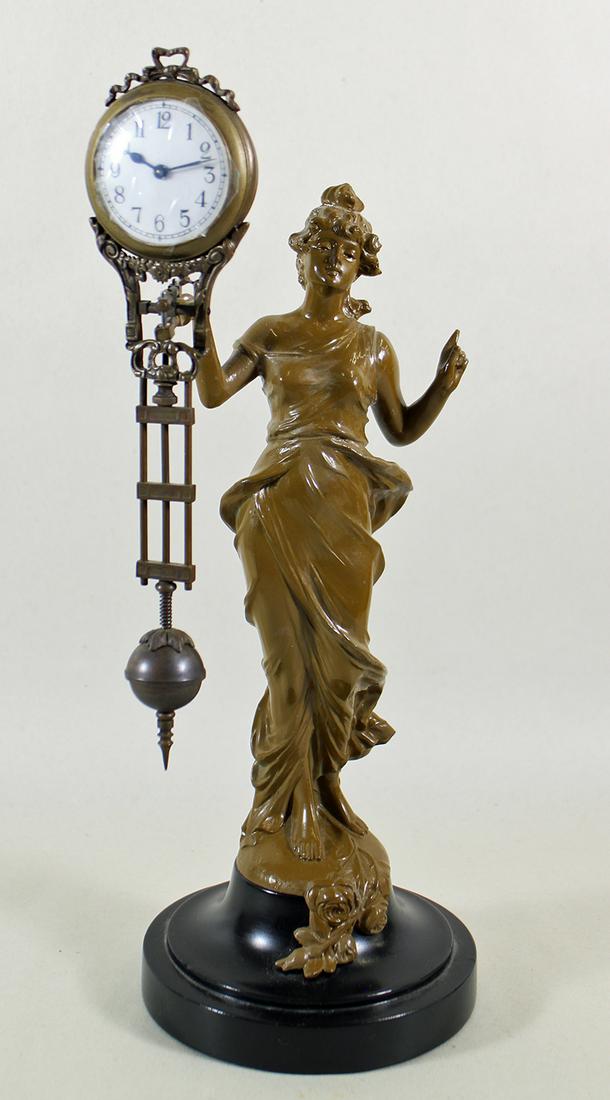 FIGURAL SWING CLOCK (1 of 3)