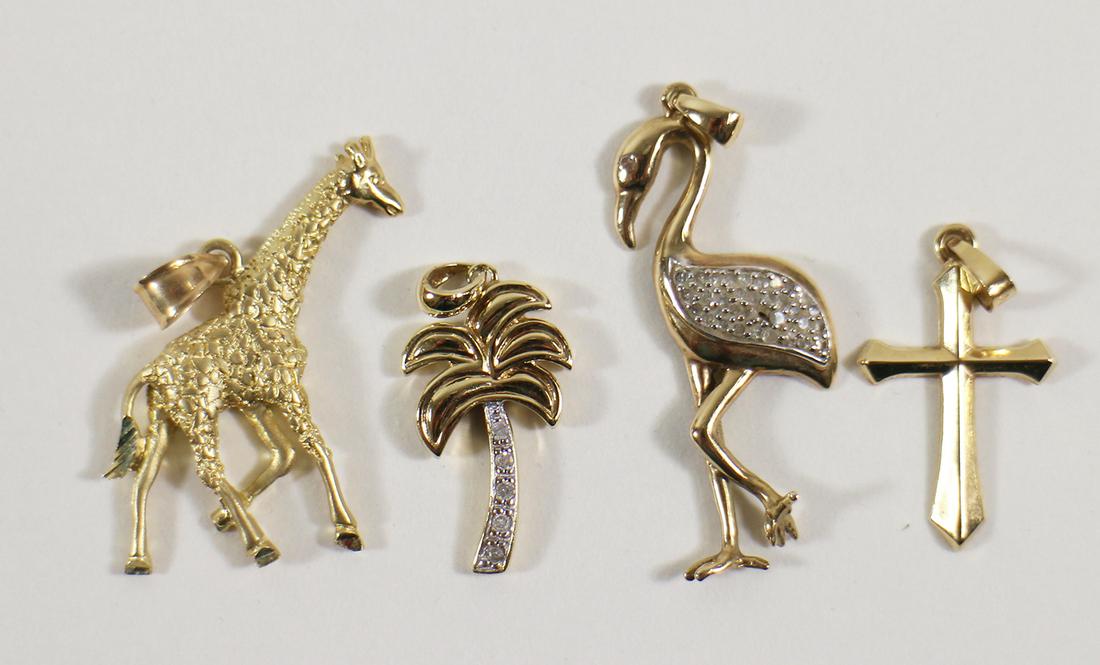 4 GOLD PENDANTS - GIRAFFE PALM TREE FLAMINGO CROSS: A collection of pendants in yellow gold. All pendants are 14K gold except the Flamingo which is 10K gold. Some with diamond accents. They weigh 4.6 DWT.