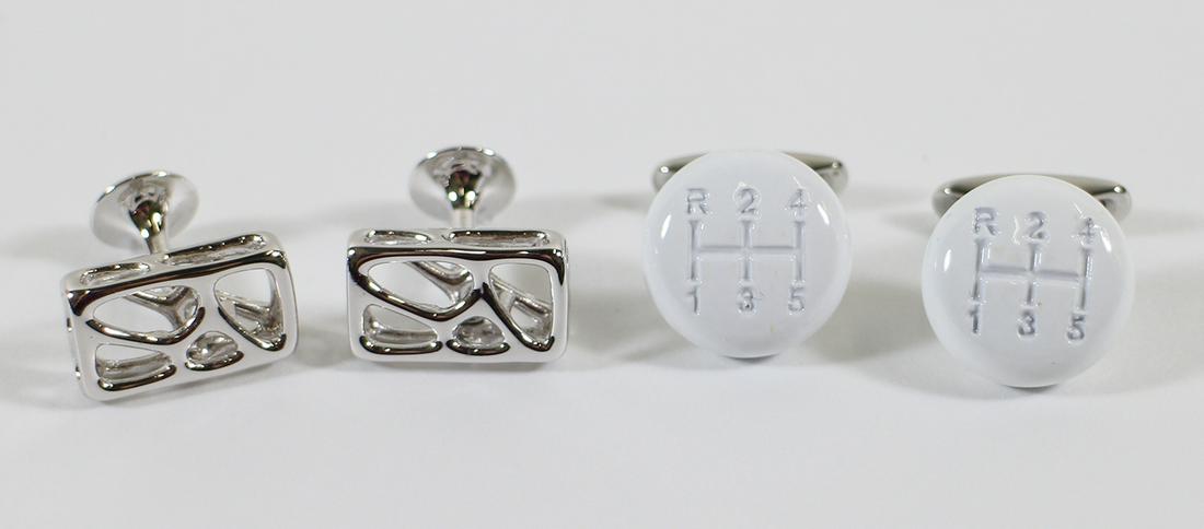 CHOPARD & LANVIN CUFFLINKS: Chopard shifter knob & Lanvin cufflinks.