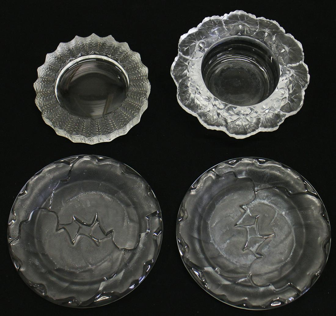 ASSORTED LALIQUE PLATES, COASTER & BOWL: A collection of assorted Lalique crystal to include 2 plates, a wine coaster and a bowl. Some small nicks.