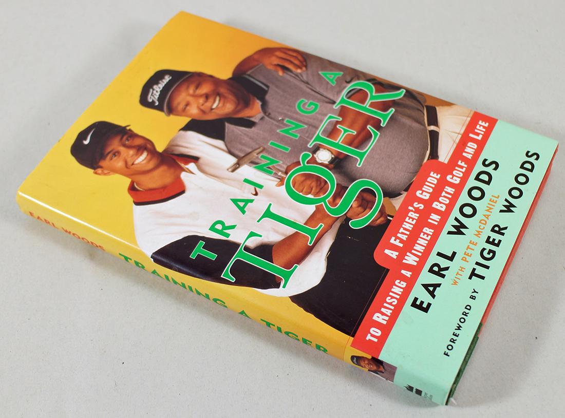 TRAINING A TIGER BY EARL WOODS - SIGNED: An autographed edition of Training a Tiger by Earl Woods with Peter McDaniel foreword by Tiger Woods.