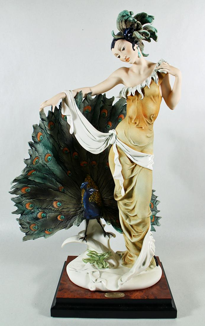 "ISADORA" GUISEPPE ARMANI LIMITED EDITION FIGURINE: Limited edition Giuseppe Armani Isadora figurine number 633C. This lady with peacock is numbered. It measures 18.5" x 11" x 9".