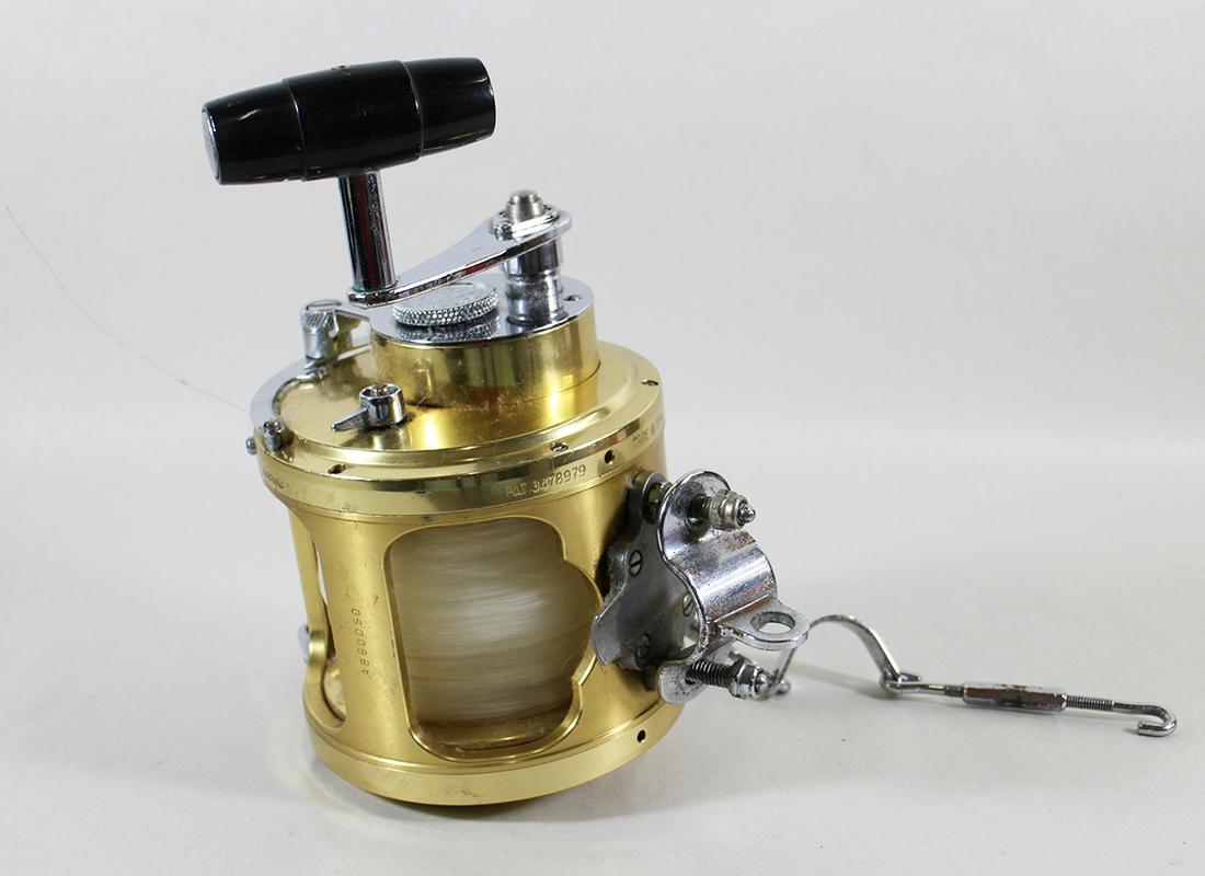 PENN INTERNATIONAL II GOLD 80S FISHING REEL: A Penn International big game gold standard fishing reel. It is Model 80S. It was made in USA and has Pat # 3478979 and the serial number engraved on the reel.