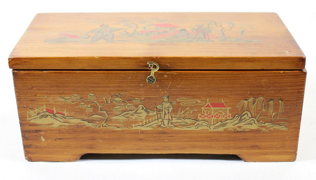 GUSTAV REBICEK CYLINDER MUSIC BOX: A cylinder music box by Gustav Rebicek. It is a working music box with key. The box is solid wood with an Japanese scene. It measures 8.5" x 4" x 3.5"
