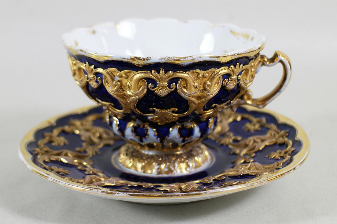 MEISSEN BLUE & GOLD TEACUP & SAUCER: Meissen blue & gold teacup and saucer. Both pieces marked on bottom.