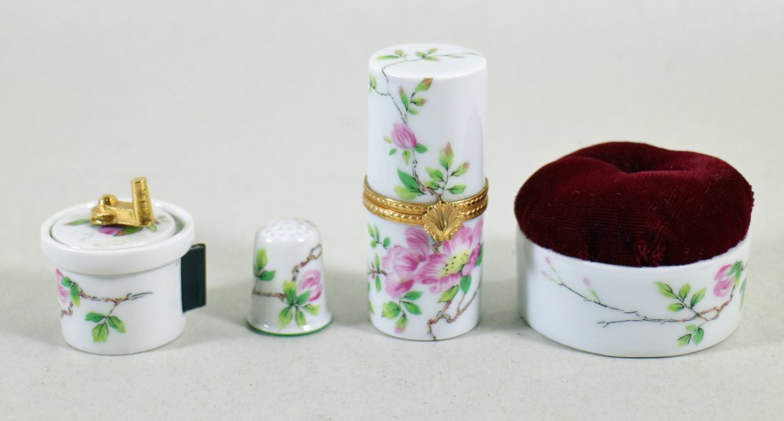 HAVILAND LIMOGES SEWING SET: Includes a pin cushion, needle holder, thimble, and measuring tape.
