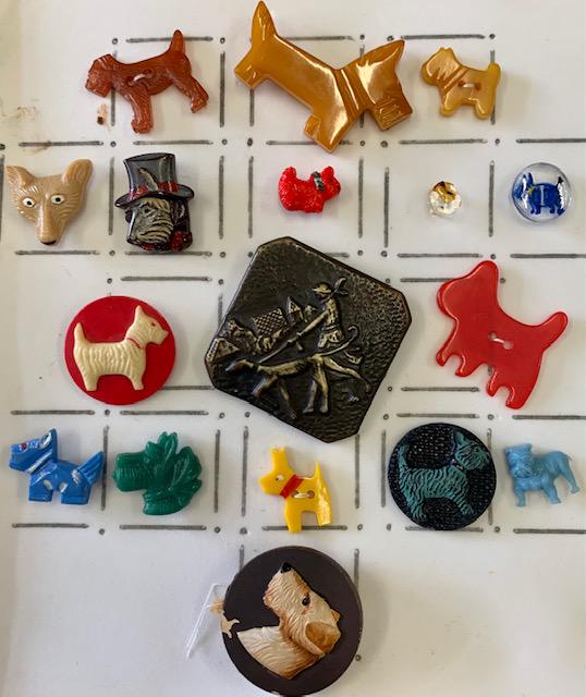 VINTAGE DOG, CAT, FISH BUTTONS: A collection of vintage novelty buttons to include bakelite, metal, lucite, ceramic, scotty dog, boxer dog , fox, fish, seahorse, whale, dolphin and more.