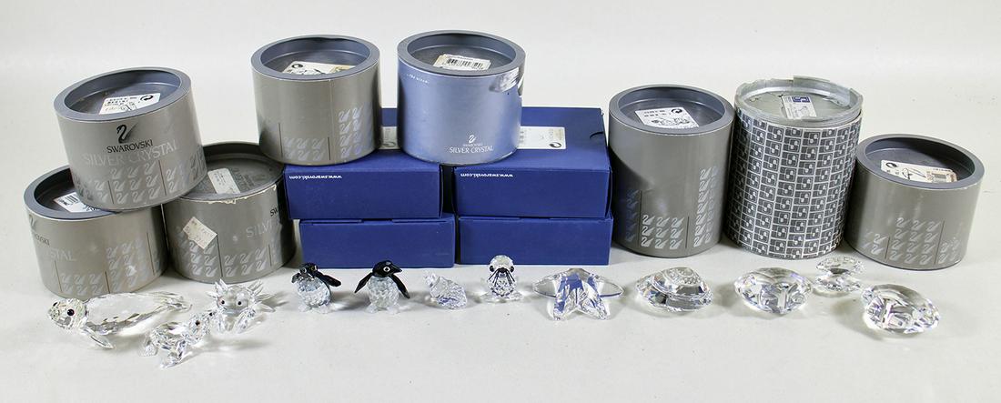 (12) SWAROVSKI CRYSTAL SEA LIFE FIGURINES: Collection of (12) Swarovski Crystal sea life figurines with boxes including shells, penguins, crab, sea lion, & more.