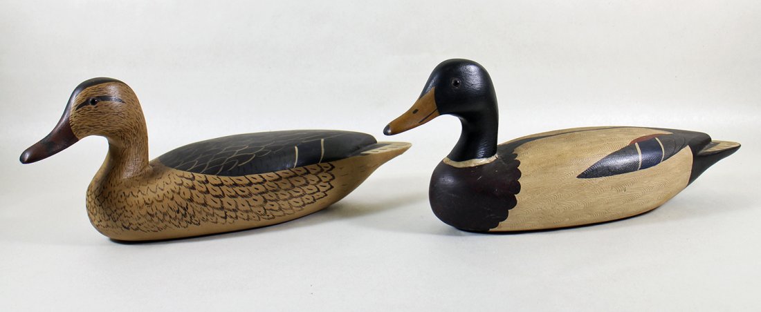 (2) CHARLES MOORE WOOD MALLARD DUCK DECOYS: Pair of vintage hollow carved wood Mallard duck decoys. Each signed on bottom Chas Moore '74. Approximately 16" long.