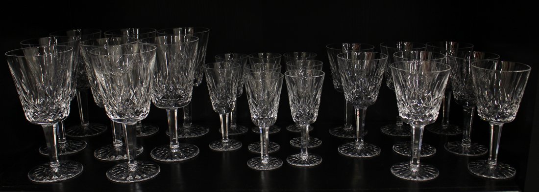 (24) WATERFORD CRYSTAL LISMORE GLASES: Waterford Crystal Lismore pattern glasses including 5" cordials, 5.75" wine glasses, and 6.75" water glasses (one with chip to rim).