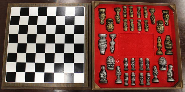 VINTAGE ALCOA ALICE IN WONDERLAND CHESS SET: Vintage circa 1970's Alcoa cast aluminum Alice in Wonderland chess set with original box. Chess pieces are assorted characters from the book. Board is 19" x 19"