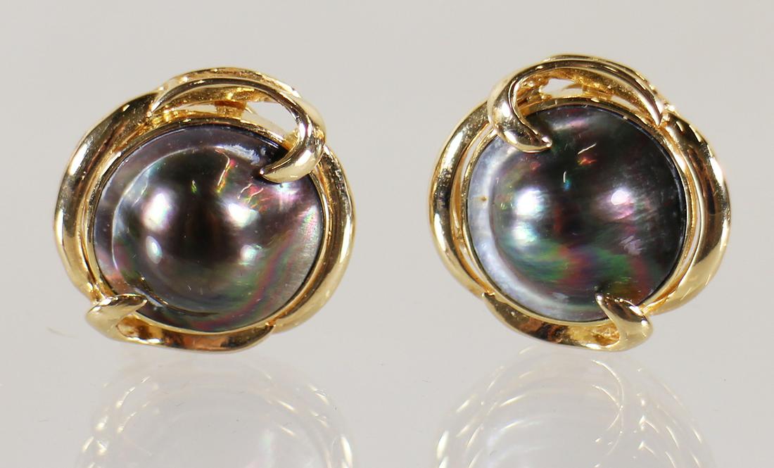 14K BLACK TAHITIAN MABE PEARL EARRINGS: A pair of Tahitian mabe pearl earrings set in 14KT yellow gold. The pearls measure 15mm.