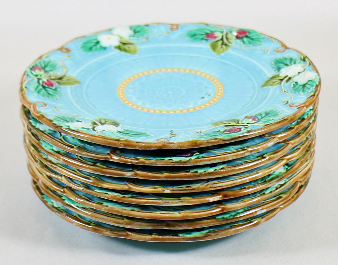 (8) SARREGUEMINES MAJOLICA PLATES: A set of 8 French majolica plates with a turquoise background with a strawberry and flower motif. 8"