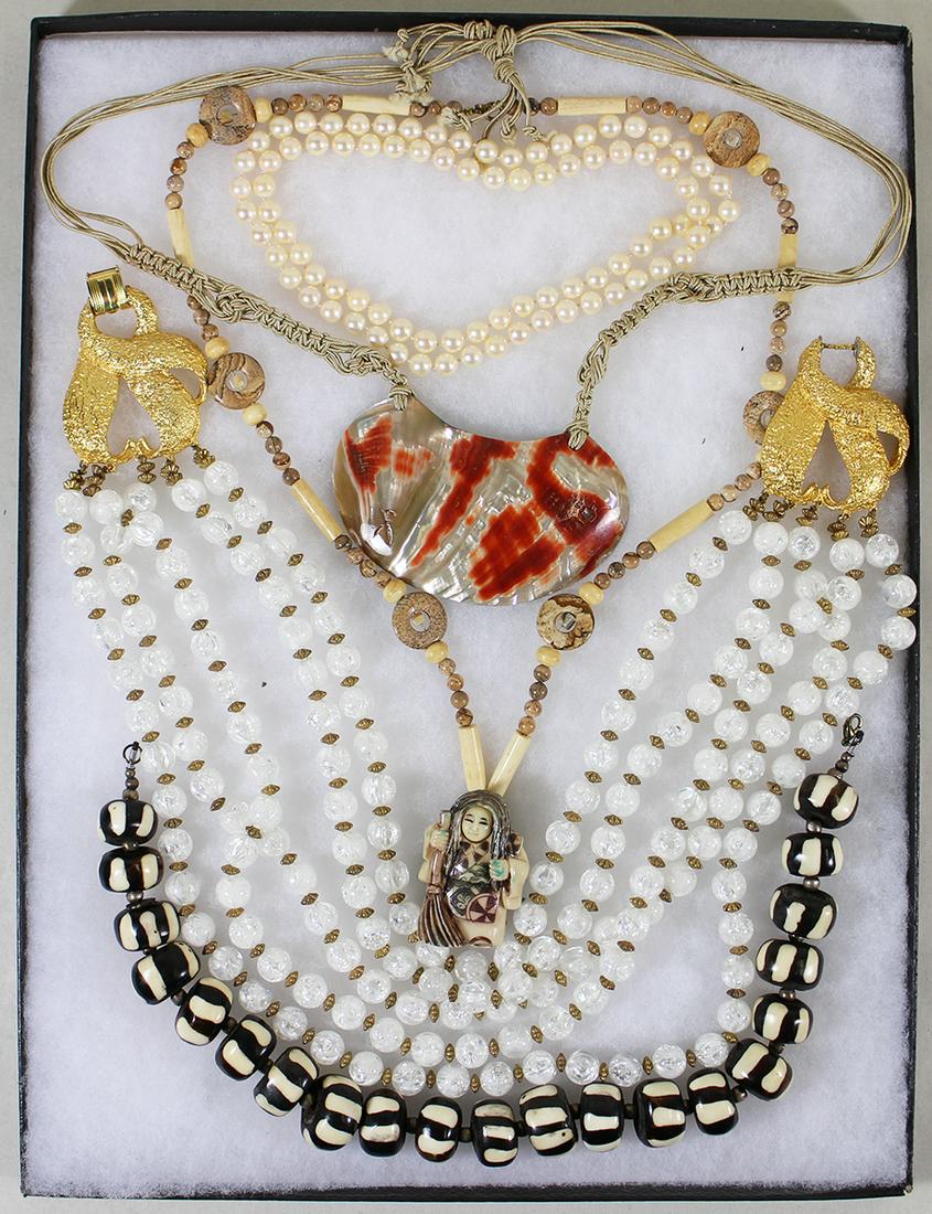 VINTAGE JEWELRY COLLECTION: A collection of vintage jewelry to include a set of 9mm hand knotted pearls, a figural necklace with a moveable face, Batik bone beads, abalone shell necklace and a 5 strand beaded necklace.