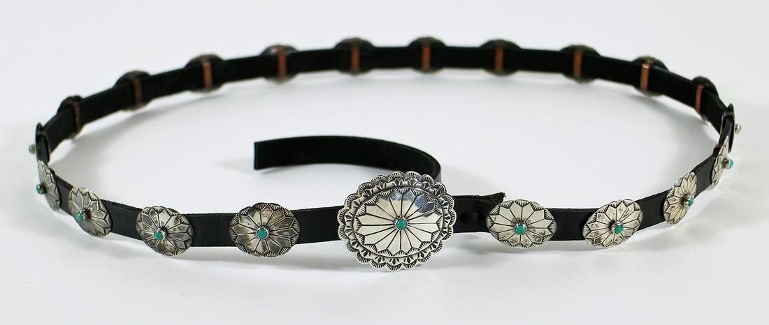 BUFFALO DANCER SILVER & TURQUOISE CONCHO BELT: A vintage concho belt signed Buffalo Dancer and Coin Silver. It has silver medallions with turquoise in the center. It measures 40" long. The medallions measure 1 1/8" long to 2" long.