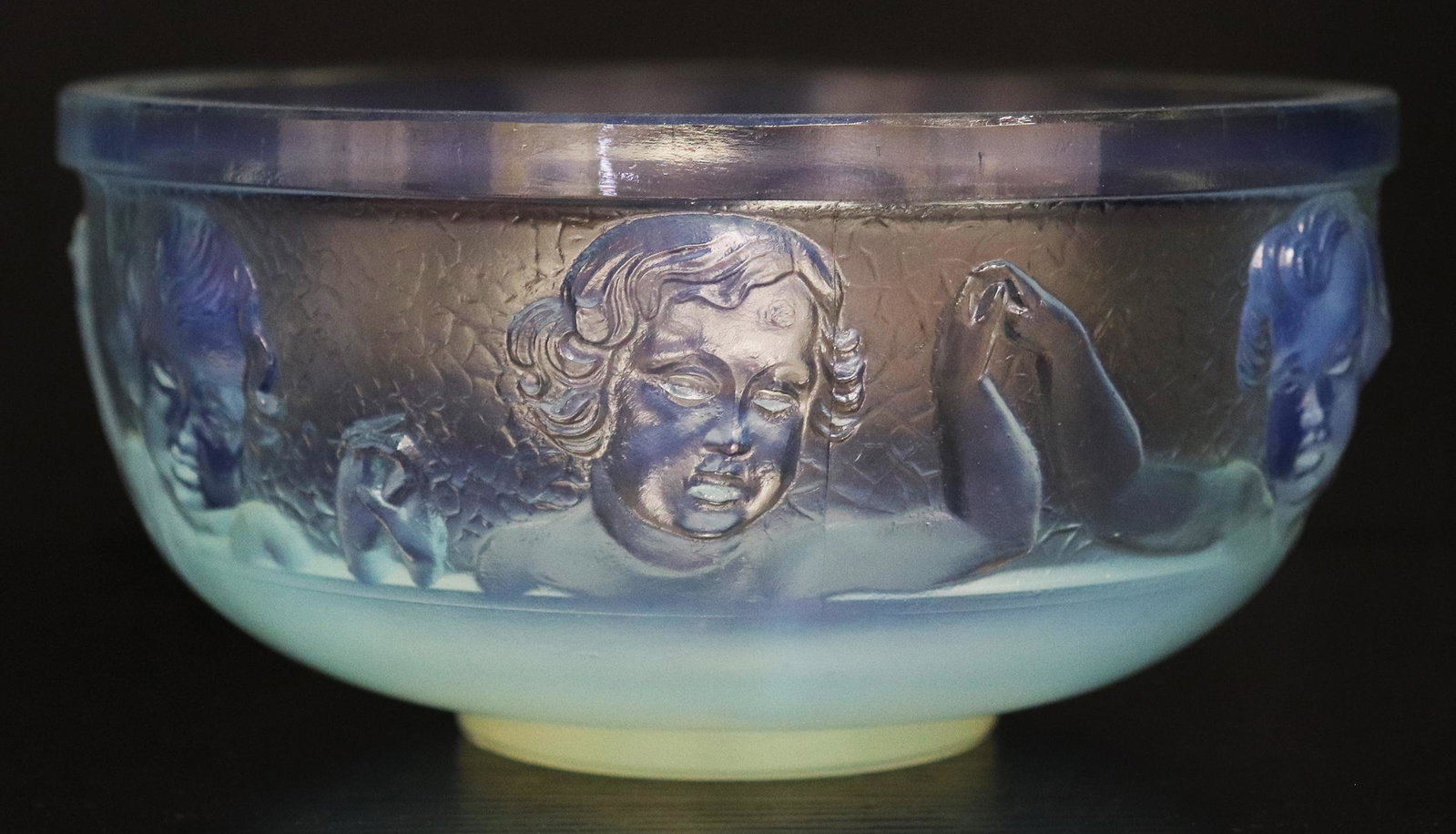 SABINO "LA RONDE ENFANTINE" ART GLASS BOWL: A signed Sabino Paris opalescent bowl with putti circling the bowl holding hands in unity. 6 1/2" W x 3 1/2" T