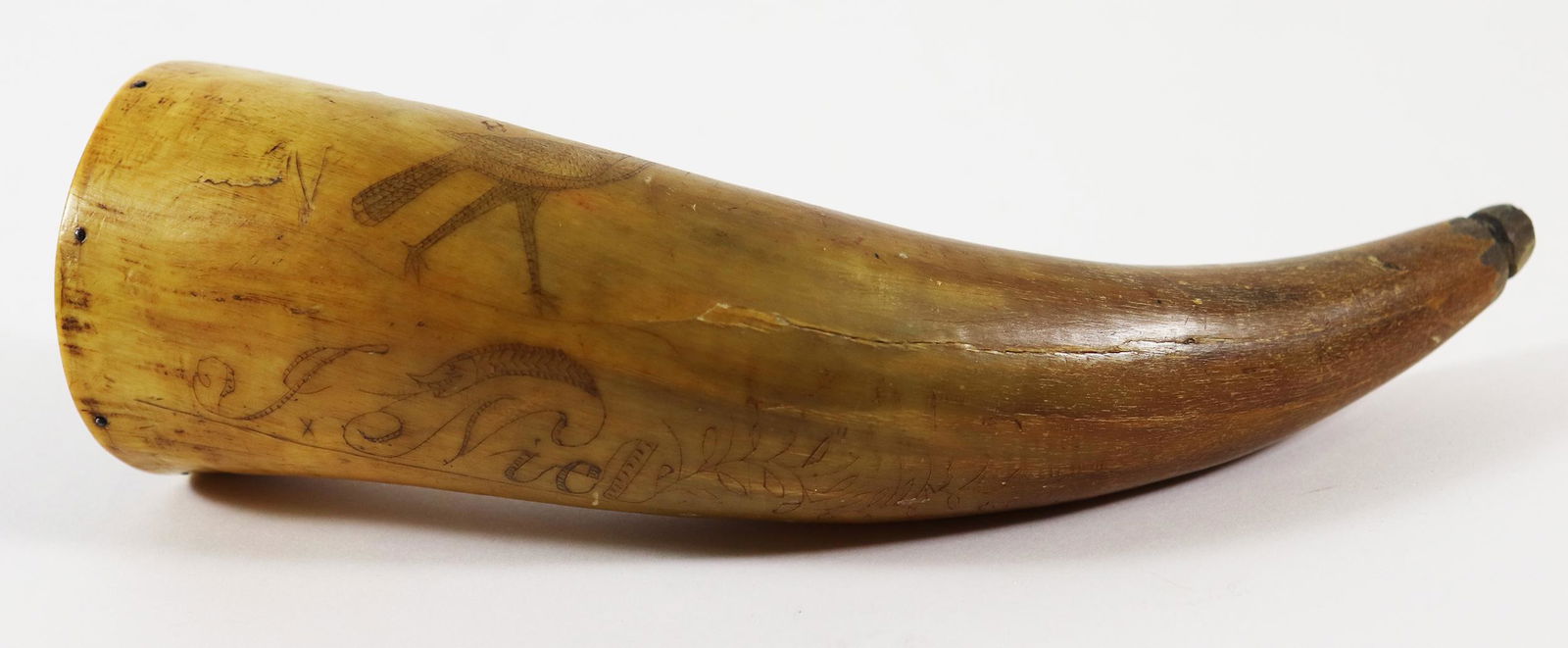 19TH CENTURY SCRIMSHAW POWDER HORN: Antique powder horn signed J Niel (?) with script and bird. Measures 7.5" long.