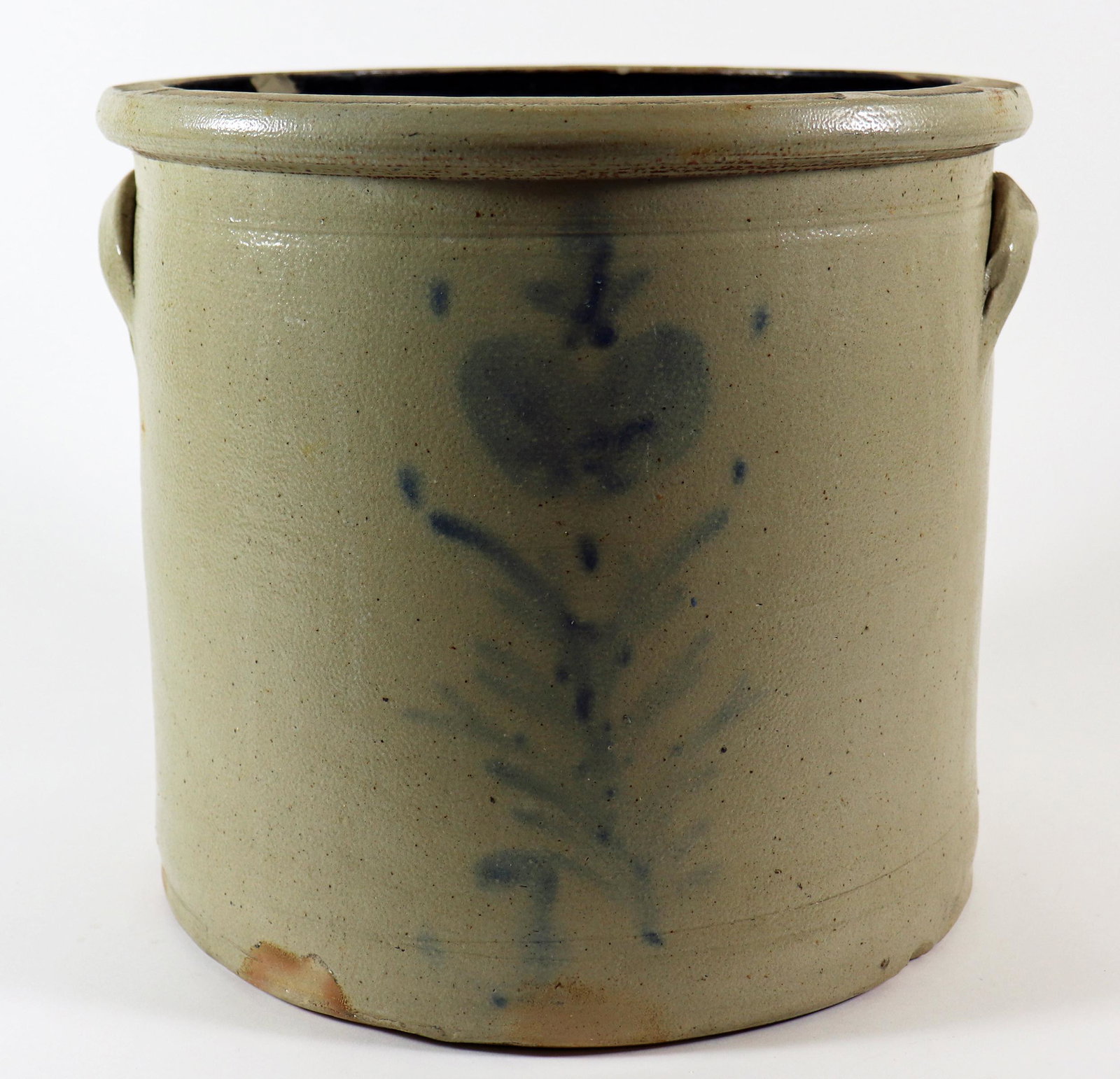 STONEWARE BLUE FLORAL OPEN CROCK: A large faintly painted blue flower and heart design on the front. Measures 10" T x 11" W.