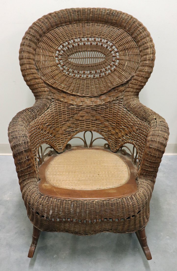 HEYWOOD WAKEFIELD ROCKING CHAIR: Vintage Heywood Wakefield wood / wicker rocking chair. Measures 27" wide 41" tall to back.