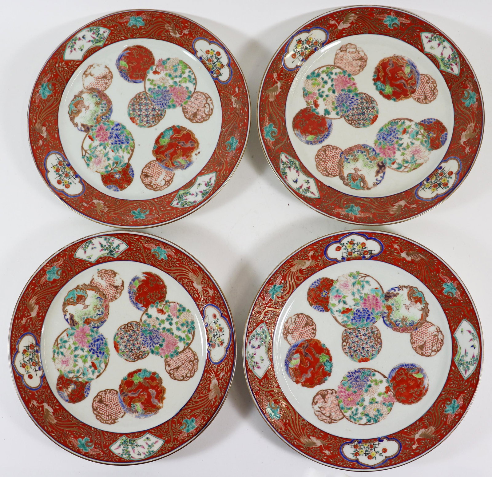 (4) JAPANESE KUTANI MEDALLION PLATES: A set of 4 Japanese Imari plates with a red boarder and medallions. Red six character mark on bottom. 9 3/4". This is part of a large Chinese & Japanese pottery collection from a private estate to inc