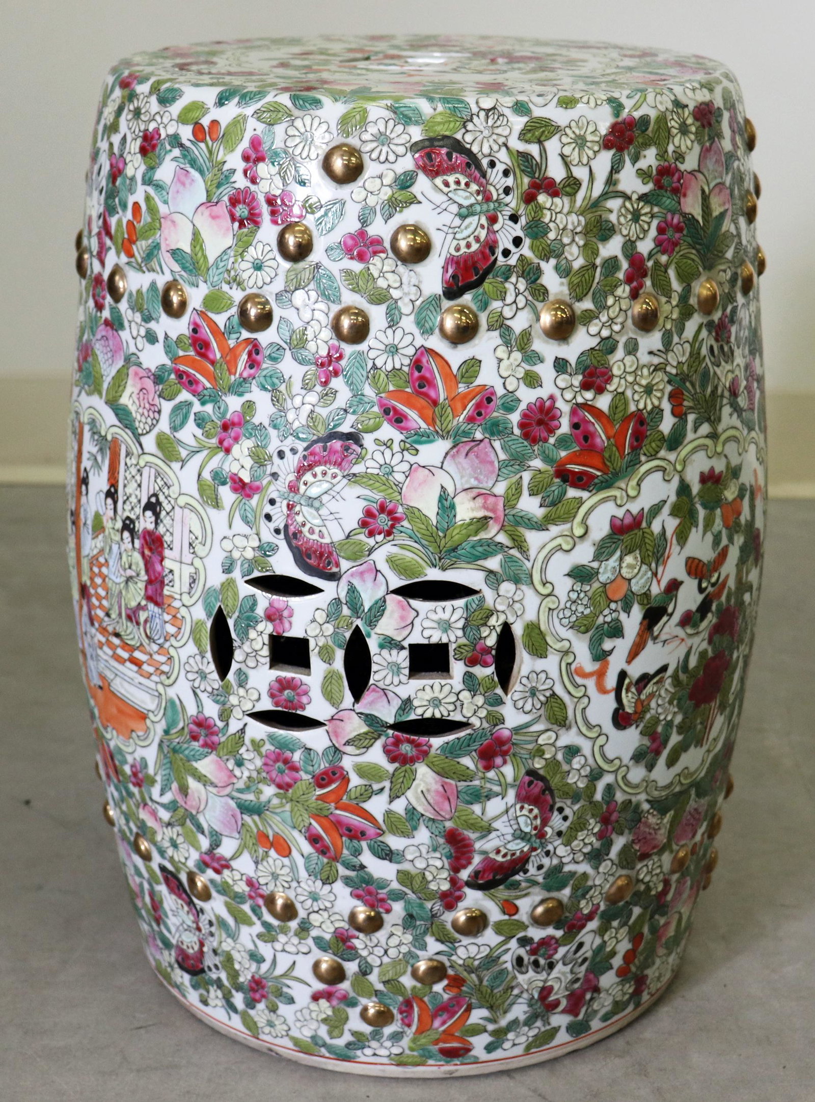 CHINESE FAMILLE ROSE PORCELAIN GARDEN STOOL: Chinese export garden seat with butterflies, flowers and pictorial scenes. Chinese red six character mark on bottom of bench. 19" X 14"