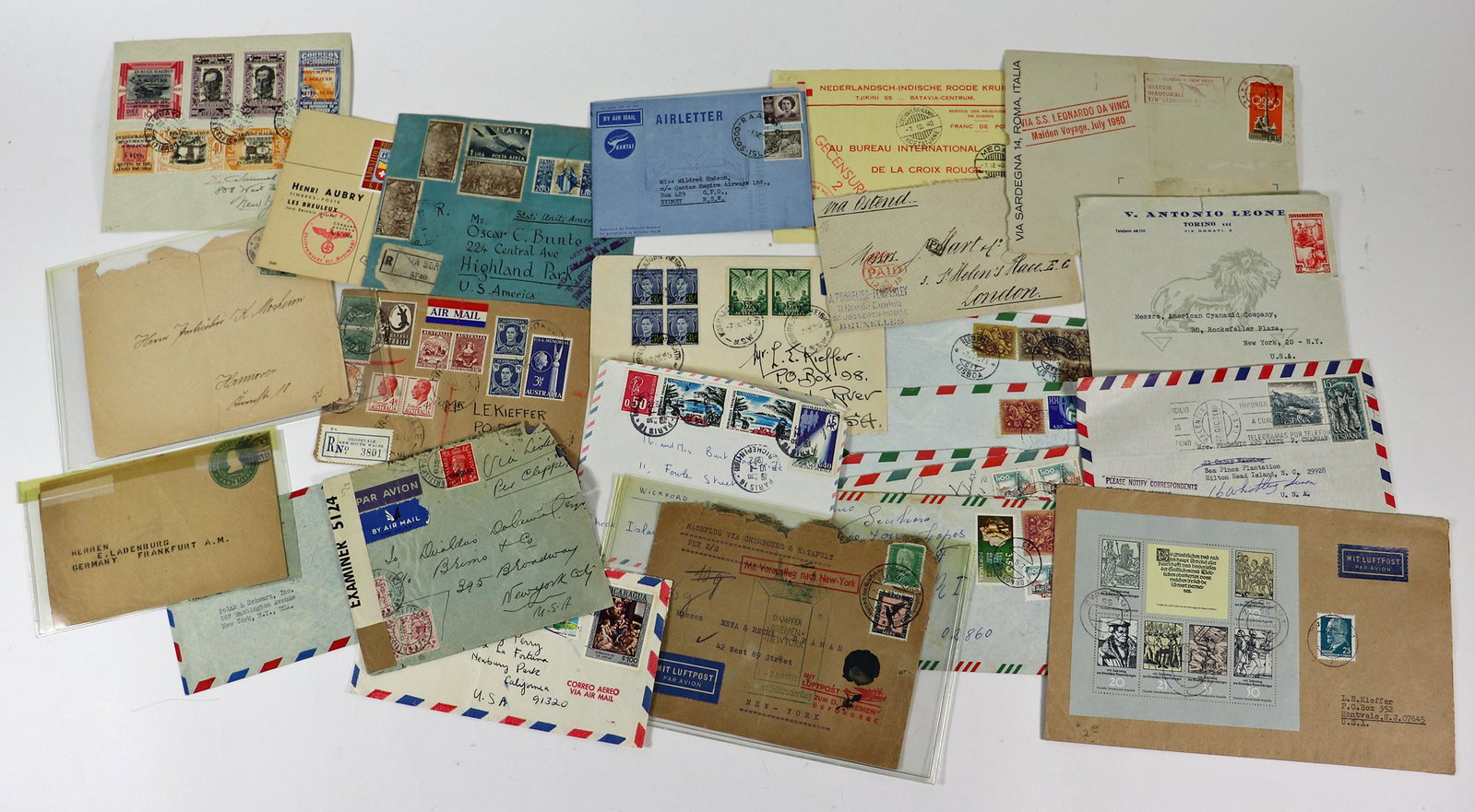 INTERNATIONAL STAMPS & ENVELOPES: Includes date stamps as early as 1871, an Mit Luftpost Par Avion envelope with a zeppelin, Italy, France, Spain, Portugal, England, Philippines Commonwealth Via Clipper, Netherlands, Australia, Costa 
