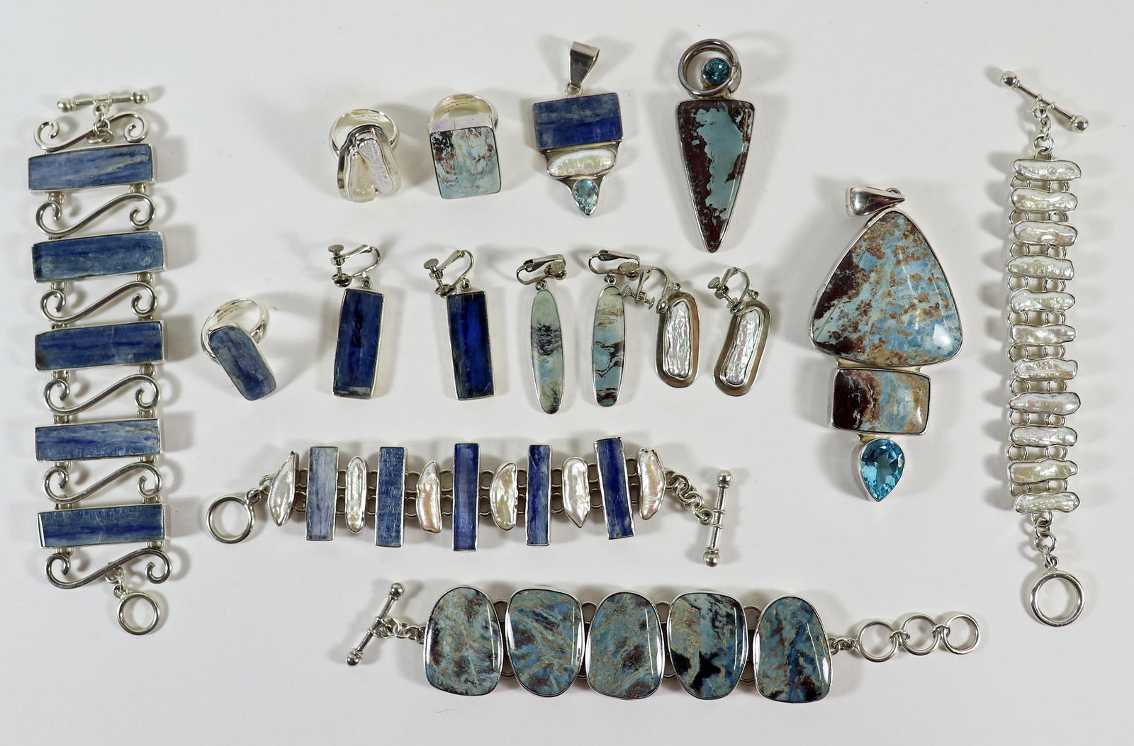 CHARLES ALBERT KYANITE, PEARL STERLING JEWERLY: A collection of Charles Albert sterling silver jewelry to include (4) bracelets, (3) pairs of earrings, (3) rings and (3) pendants. Charles Albert jewelry is made of natural stones and can include Kya