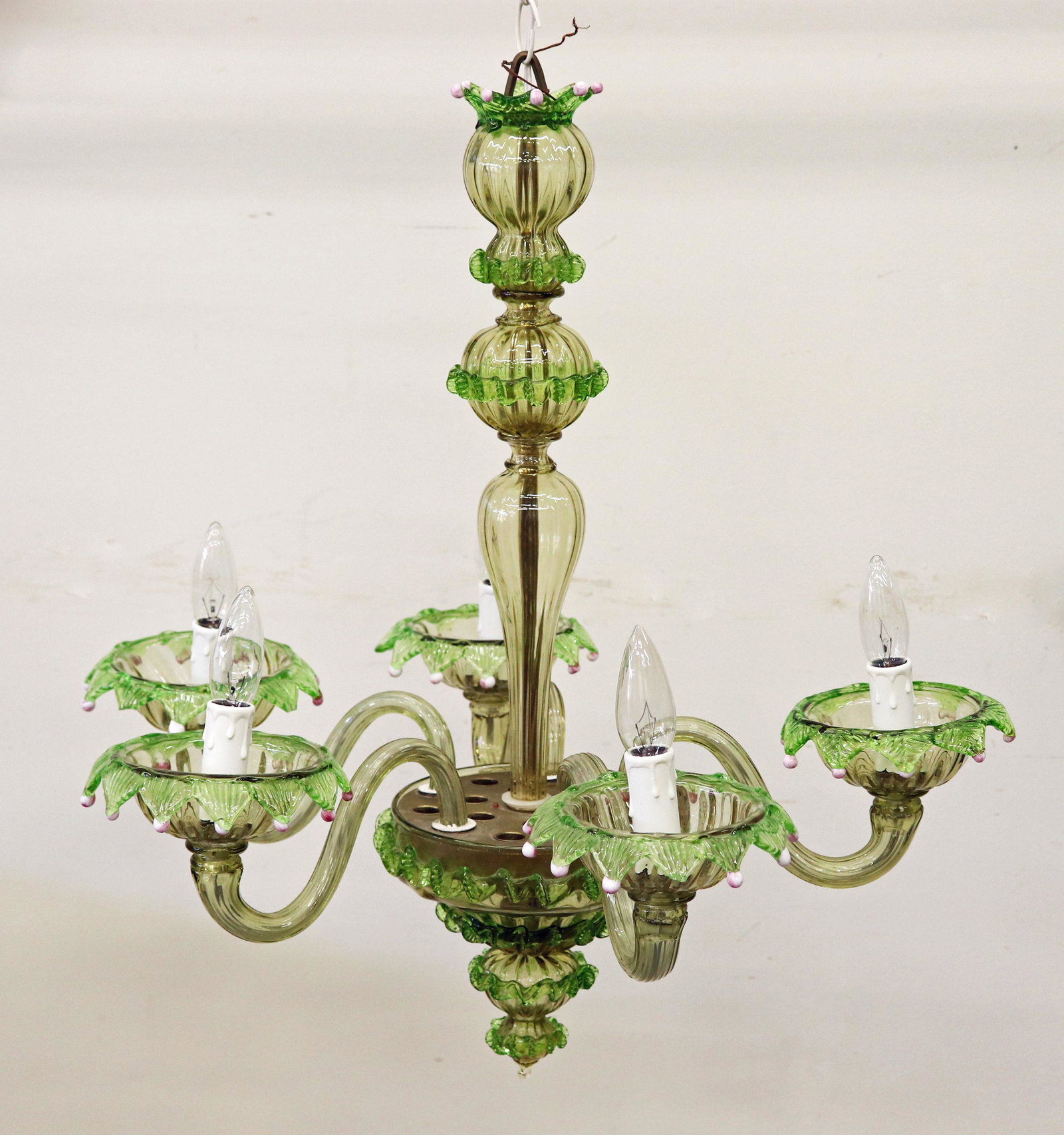 MURANO VENETIAN GLASS CHANDELIER: A 5 arm blown glass chandelier with light green and clear glass with little pink glass balls on the tips (missing a few balls). It measures 23"W x 24" L. Label reads, Vetreria Toso Cesare Murano Made 