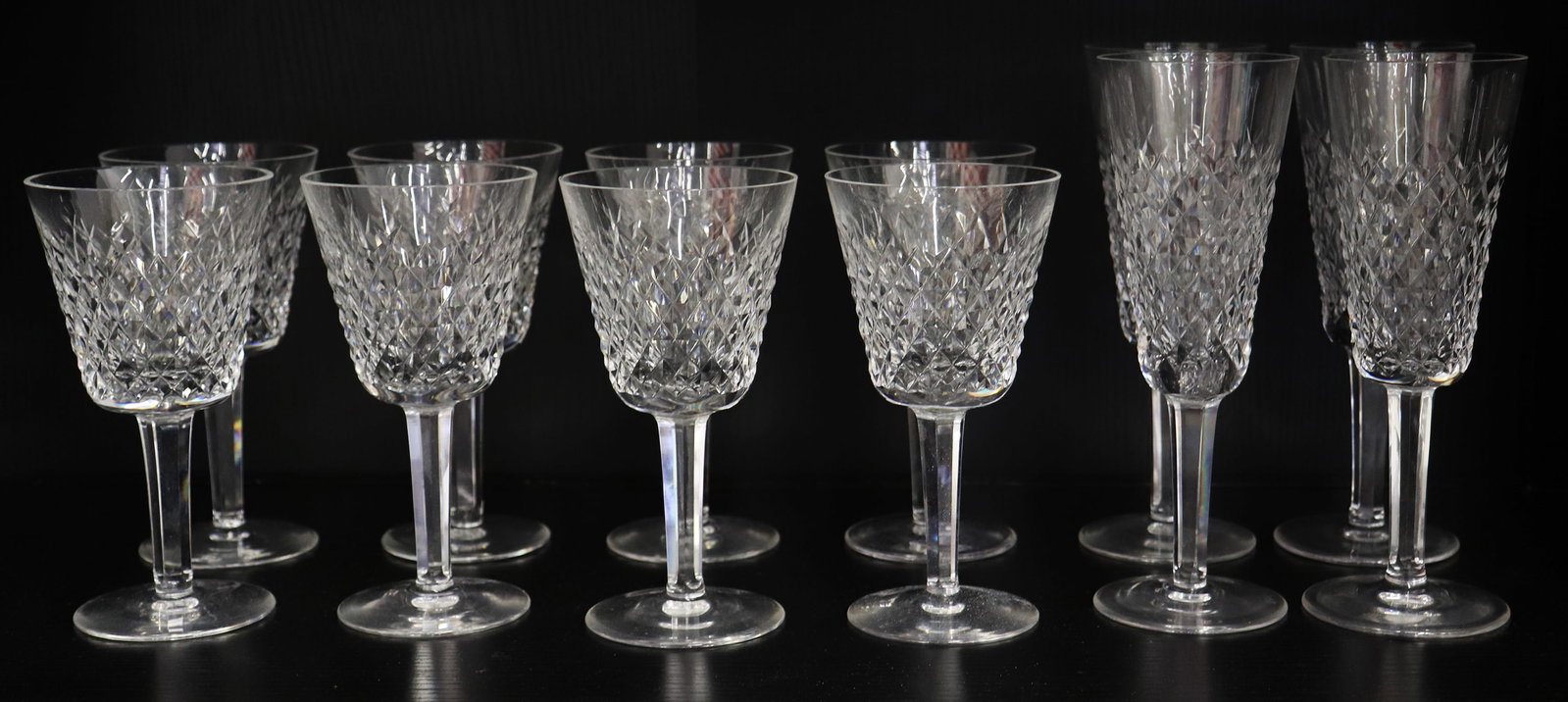 (12) WATERFORD CRYSTAL ALANA WINE & CHAMPAGNE: Collection of Waterford Crystal Alana pattern glasses including (8) 5 7/8" tall wine glasses and (4) champagne flutes.