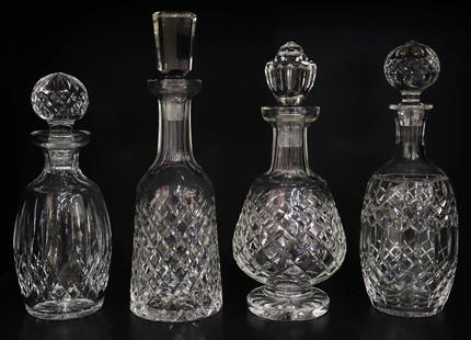 (4) WATERFORD CRYSTAL DECANTERS: Collection of (4) Waterford Crystal liquor decanters. 10.5" to 13" tall