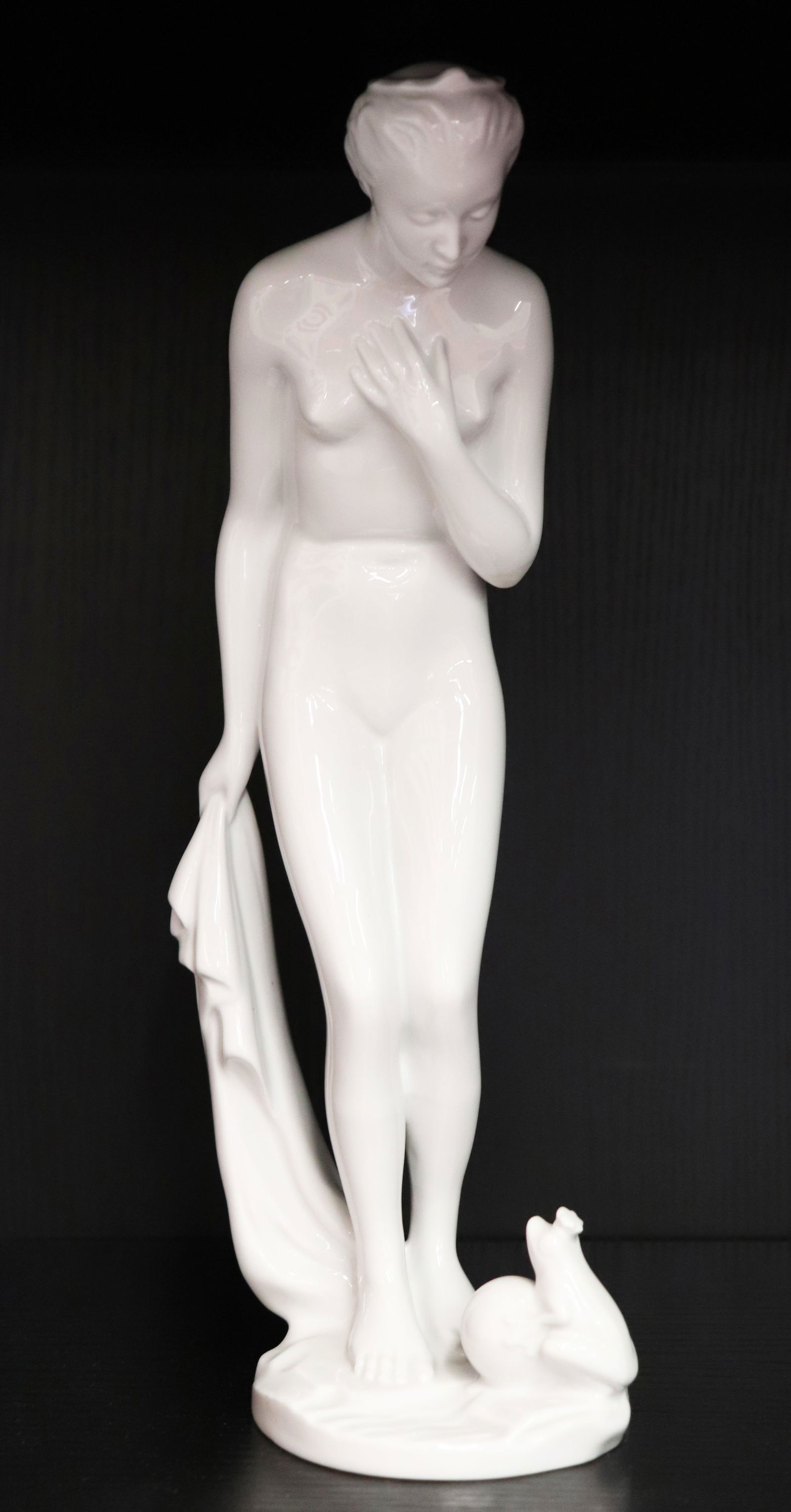 HEREND WHITE NUDE FIGURE: Herend white porcelain nude figurine with frog. Measures 11.25" tall.