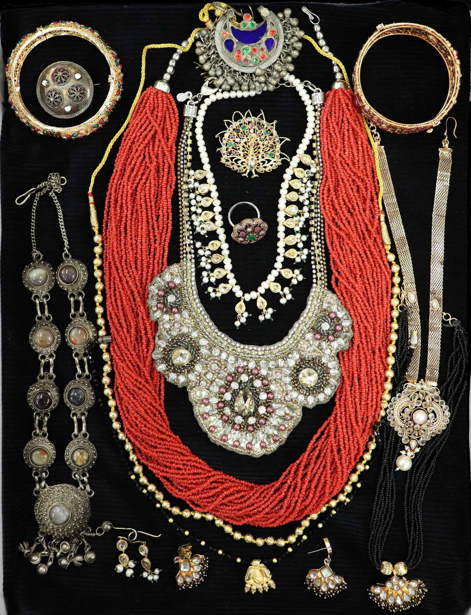 MUGHAL STYLE JEWELRY COLLECTION: A collection of Mogul style jewelry to include bracelets, ring, necklaces, earrings.