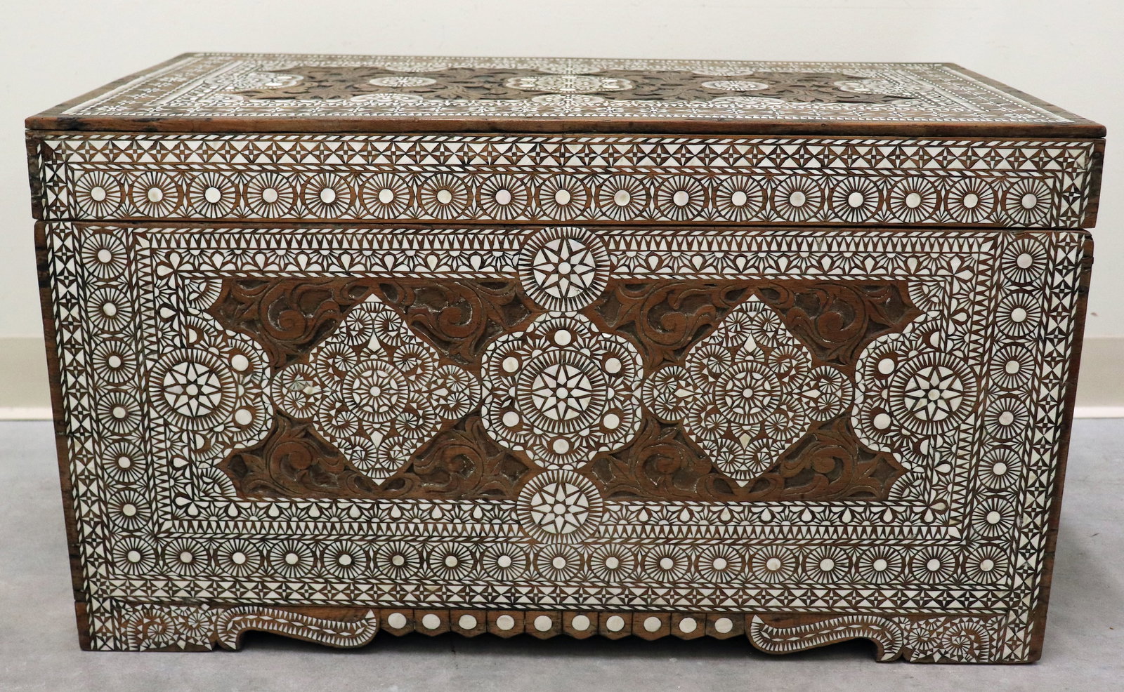 INDONESIAN MOTHER OF PEAL INLAID CHEST: Indonesian / Moroccan mother of pearl inlaid wood trunk. Measures 30.75" x 16" wide 17.25" tall.